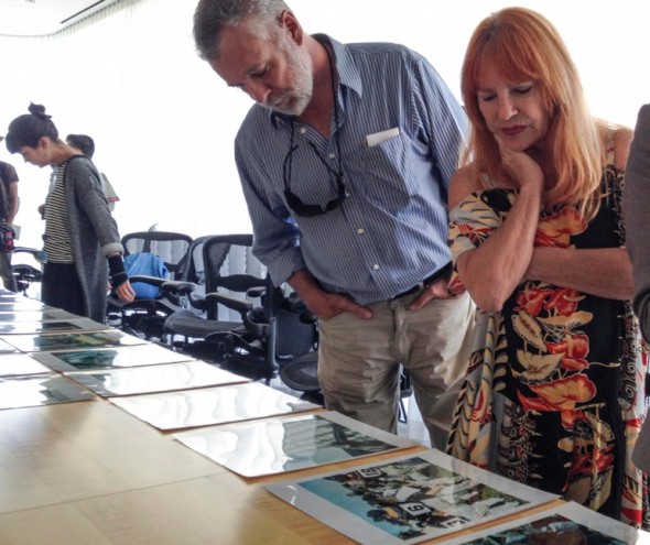 Professor Gerard Burkart and Pierce Media Arts student Lynn Levitt look at Mikiko Hara's prints during a master class at the Getty for community college students. (Photo: Jill Connelly)